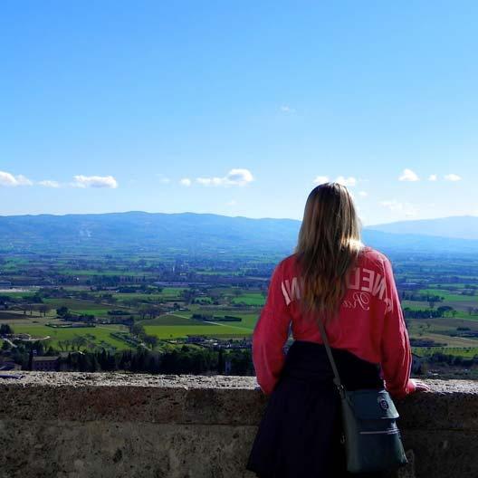 A Benedictine student looking out over an Italian landscape